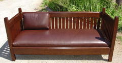 Additional view of the same design in a different stain and leather. Shown with only one of the three leather back cushions included with each large settle.  Taken with camera flash.   PLEASE "CLICK" PHOTO FOR ENLARGED IMAGE OF SETTLE.